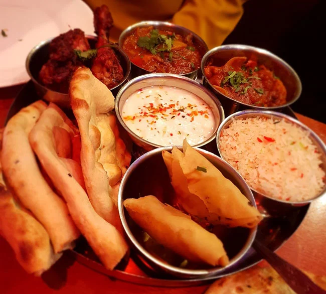 Tandoori Chicken, Lamb Samosa, Chicken Tikka Masala, Lamb Madras, Pilau Rice, Bread Naan and Raitha at Aladin