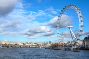 the london eye is a giant ferris wheel on the south bank of the River thames near westminster bridge