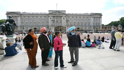 Suzanne Plunkett | Bloomberg | Getty Images A family of Sikh tourists from Mumbai