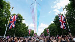 The Red Arrows left their signature red, white and blue trails in the skies above the Mall