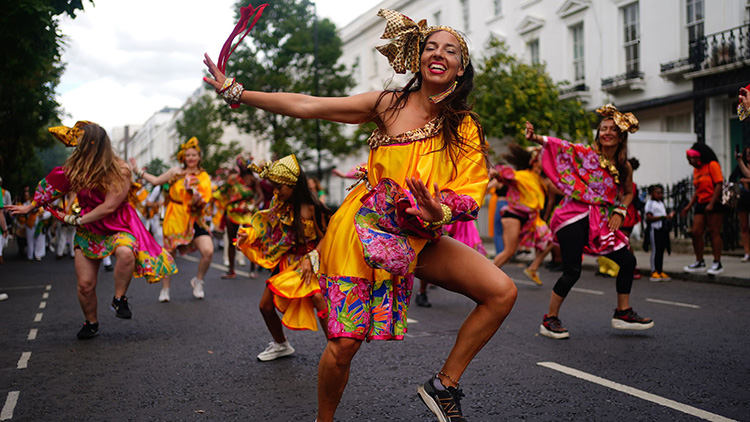 Brass band dancers in notting hill carnival 2022