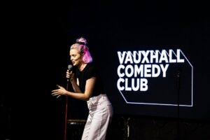 stand up comedian doing their act at vauxhall comedy club