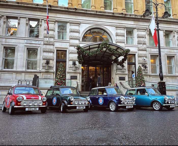 Mini Coopers convoy lined up outside London Hotel